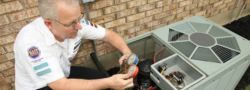 HVAC contractor tests an HVAC system for a homeowner to ensure it is energy efficient.