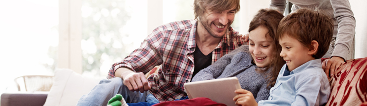 Mother and Father laughing with his son and daughter after installation of a ductless mini split system