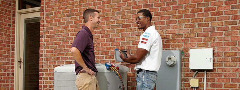 HVAC technician showing customer the results