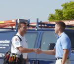 HVAC technician greeting customer