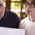 Contractor reviewing paperwork with the homeowner